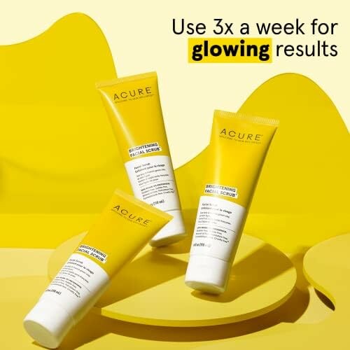 Acure brightening facial scrub tubes on yellow background with text 'Use 3x a week for glowing results'.