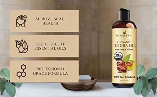 Handcraft Organic Jojoba Oil bottle with benefits listed: improve scalp health, dilute essential oils, professional grade formula.