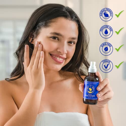 Woman applying a face serum with eco-friendly labels in the background.